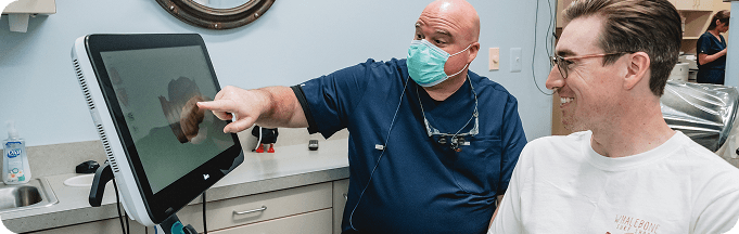 Dr. Bennett reviewing a digital scan with a patient