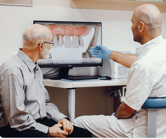Dental hygienist cleaning a patient's teeth