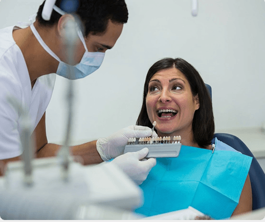 Dental hygienist cleaning a patient's teeth