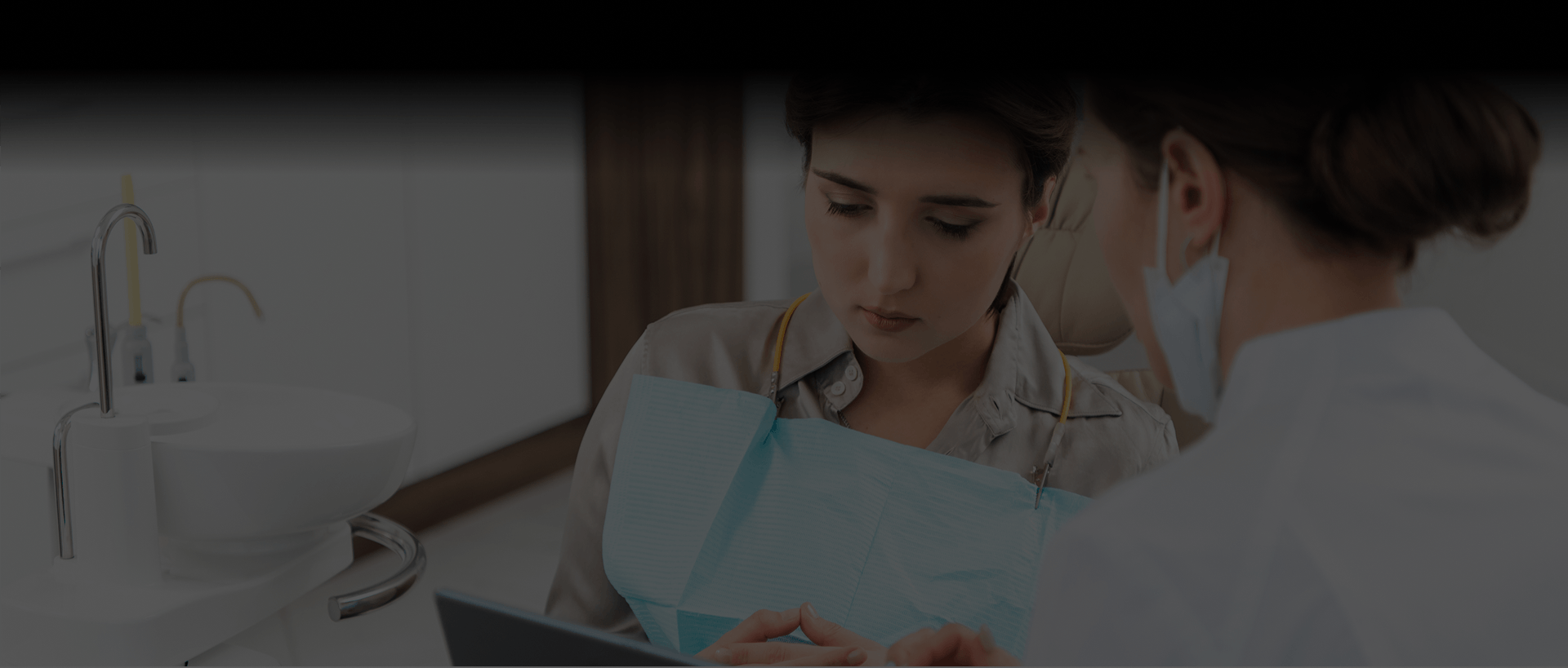 Dental team member reviewing treatment with a patient