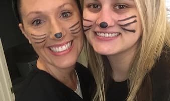 Landmark Smiles team members with cat face paint