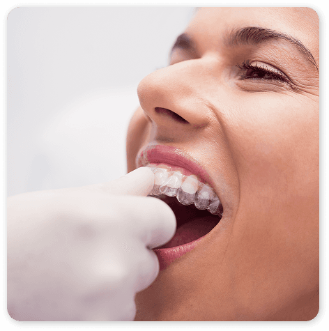 Dental team member checking a patient's smile